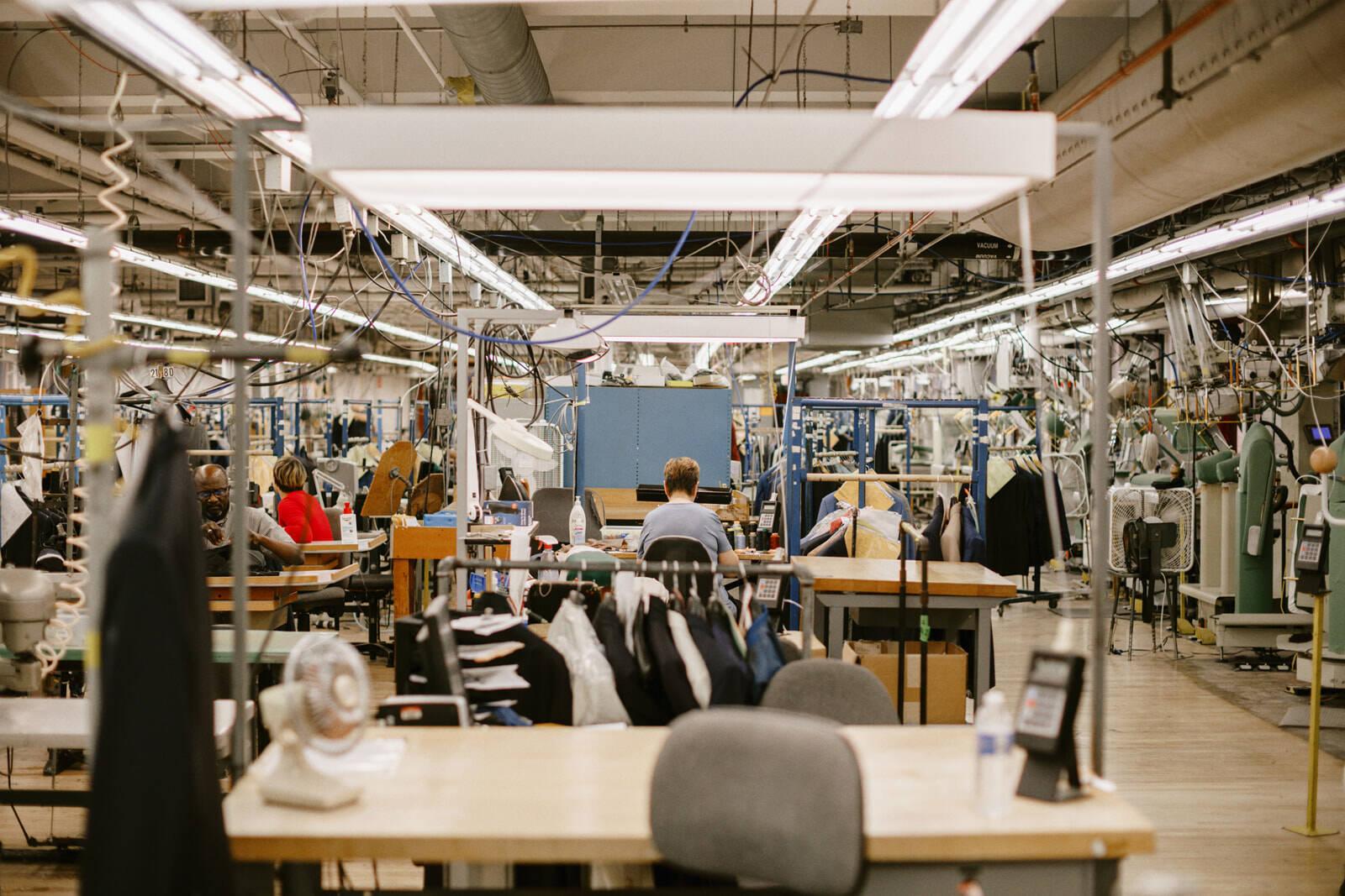 Hand-sewing and reweaving in our tailoring factory today